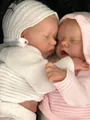 Realistic 48cm reborn baby dolls wearing white and pink knitted hoodies in a pair - 48cm / Pink