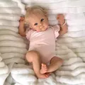 18-inch realistic reborn doll Bettie with blonde curls and pink outfit on soft rug - Exquisite 3D Painted / Full Silicone Body