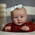 Lifelike 24-inch reborn boy doll wearing rust-red knit sweater and white bow headband - 60cm Cloth Body / Rust red