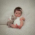 18-inch realistic reborn baby Bettie doll in white knit romper with crochet bear - Exquisite 3D Painted Style / Full Silicone Body