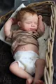 Sleeping 49cm reborn baby doll with brown shirt and diaper in a woven basket - 50cm Boy Style