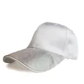 Detail shot of the white satin baseball cap showing sparkling rhinestone brim and texture - White