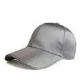 Detail of shimmering iridescent rhinestones on a grey satin baseball cap visor - Gray