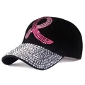 Detail of black baseball cap with rhinestone brim and pink ribbon crystal emblem - Black