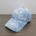Detailed macro of silver sequins and distressed torn fabric on the denim baseball cap - Sky Blue