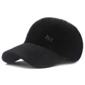 Close-up of black plush baseball cap with fluffy texture and silver metal M logo - Adjustable / Black (5-Panel No Pom-pom Style) / Adult