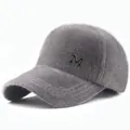 Detailed close-up of gray plush baseball cap featuring a metallic M logo and soft fur texture - Adjustable / Gray (5-Panel No Pom-pom Style) / Adult