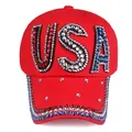 Detailed view of red cotton baseball cap featuring USA rhinestone letters and crystals - Red