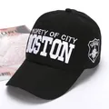 Black cotton baseball cap with Boston embroidery and side patch in a 45-degree view - Black