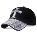 Close-up of a black baseball cap with rhinestone cross patch and shimmering diamond brim - Adjustable / Black