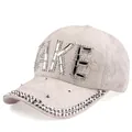Close-up of white lace baseball cap featuring rhinestones and FAKE letter decoration - Adjustable / White