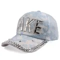 Close-up of lace baseball cap with TAKE rhinestone lettering and sparkling brim detail - Adjustable / Blue