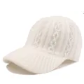 Close-up of white knit baseball cap featuring vertical ribbing and colorful rhinestone chains - Adjustable / White