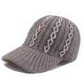 Detail of grey knitted baseball cap with iridescent rhinestone wave patterns and brim - Adjustable / Gray