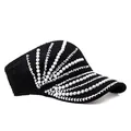 Detail of black knitted sun visor with elegant white pearls and sparkling rhinestone trim - Adjustable / Black