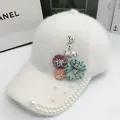 White plush baseball cap with rhinestone deer pin, fabric flowers and pearl brim - Adjustable / White