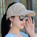 Detail of knitted sun visor featuring elegant pearls and silver rhinestone embellishments - Adjustable / Khaki