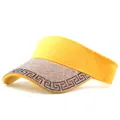 Detailed view of yellow visor hat with sparkling rhinestones forming decorative patterns - Letter Pattern Yellow
