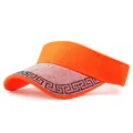 Detail of vibrant orange open top visor featuring sparkling rhinestone embellishments - Letter Pattern Orange
