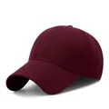Detailed view of burgundy cotton baseball cap with structured six-panel crown design - Adjustable / Burgundy