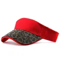 Detail of red sun visor hat featuring leopard print sequins and rhinestone embellishments - Red Leopard