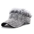 Detail view of sparkly rhinestones and fluffy grey synthetic hair on black visor hat - Grey Hair Silver Rhinestones