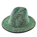 Close-up of sparkling iridescent rhinestones on a vintage fedora jazz hat - Black Hat with Green Rhinestones