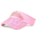 Detail of pink sun visor with crown rhinestones and glitter crystals on the brim - Adjustable / Pink