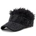 Close-up of black sun visor hat featuring sparkling rhinestones and synthetic hair piece - Black Hair Black Rhinestones