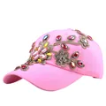 Pink cotton baseball cap featuring floral embroidery and colorful rhinestones - Adjustable / Pink