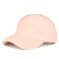 Detailed macro shot of the pink plush textured fabric on the warm winter baseball cap - Adjustable / Pink