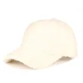 Close-up of cream white plush texture and 6-panel structure on warm baseball cap - Adjustable / Beige