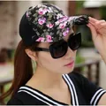 Close-up of women floral baseball cap with breathable black mesh and vibrant patterns - Mesh Style / Black