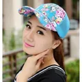 Detail of floral pattern on the visor and blue breathable mesh of the baseball cap - Mesh Style / Sky Blue