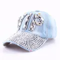 Close-up of VIP rhinestone lettering and silver diamond-studded denim baseball cap brim - Clear Rhinestone Denim 2