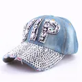 Detail view of denim VIP baseball cap with purple rhinestones and silver studded brim - Clear Rhinestone Denim 4