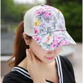 Close-up of women's floral trucker hat featuring pink roses and breathable mesh detail - Mesh Style / Beige