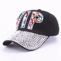 Detail of hand-set rhinestones and colorful VIP crystals on a black baseball cap - Colorful Rhinestone Black