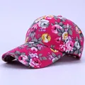 Close-up of pink rose floral pattern on a durable canvas baseball cap for women - Fabric Style / Rose Red