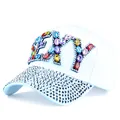 Close-up of light blue baseball cap with shiny colorful rhinestones on FLY lettering - Adjustable / White