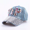 Detailed close-up of blue denim baseball cap with VIP rhinestones and crystal brim - Colorful Rhinestone Denim 4