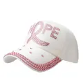 White baseball cap with pink rhinestones spelling HOPE and ribbon on the front - White