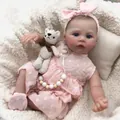 Lifelike 49cm reborn doll in pink polka dot dress with pacifier and crochet bear - Cloth Body Style / Pink / 49cm