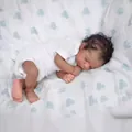 Realistic 19-inch reborn baby doll sleeping in white onesie with curly black hair - Cloth Body Style / 49cm