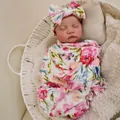 Newborn swaddle and bow headband set with vibrant 3D floral prints in a cozy basket - Full Silicone Style / Colorful Floral