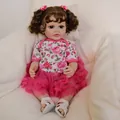 55cm lifelike reborn baby doll Betty with brown curly hair and pink flower headband - 55cm / Full Silicone Body Style