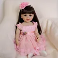 Reborn Betty doll with long brown hair, pink floral headband and lace princess dress - 55 cm / Full Silicone Body Style