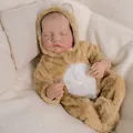 Close-up detail of realistic skin texture and closed eyes of a sleeping 19-inch reborn doll - Cloth Body Style