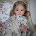 Realistic 26-inch reborn doll with blonde hair and floral dress on a floral chair - Floral Cloth Body Style / 26 Inch