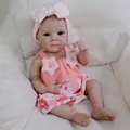 Lifelike 18 inch reborn baby doll with blue eyes in a pink floral outfit and headband - Pink Star Floral Style Full Vinyl Body / 48cm Vinyl Body